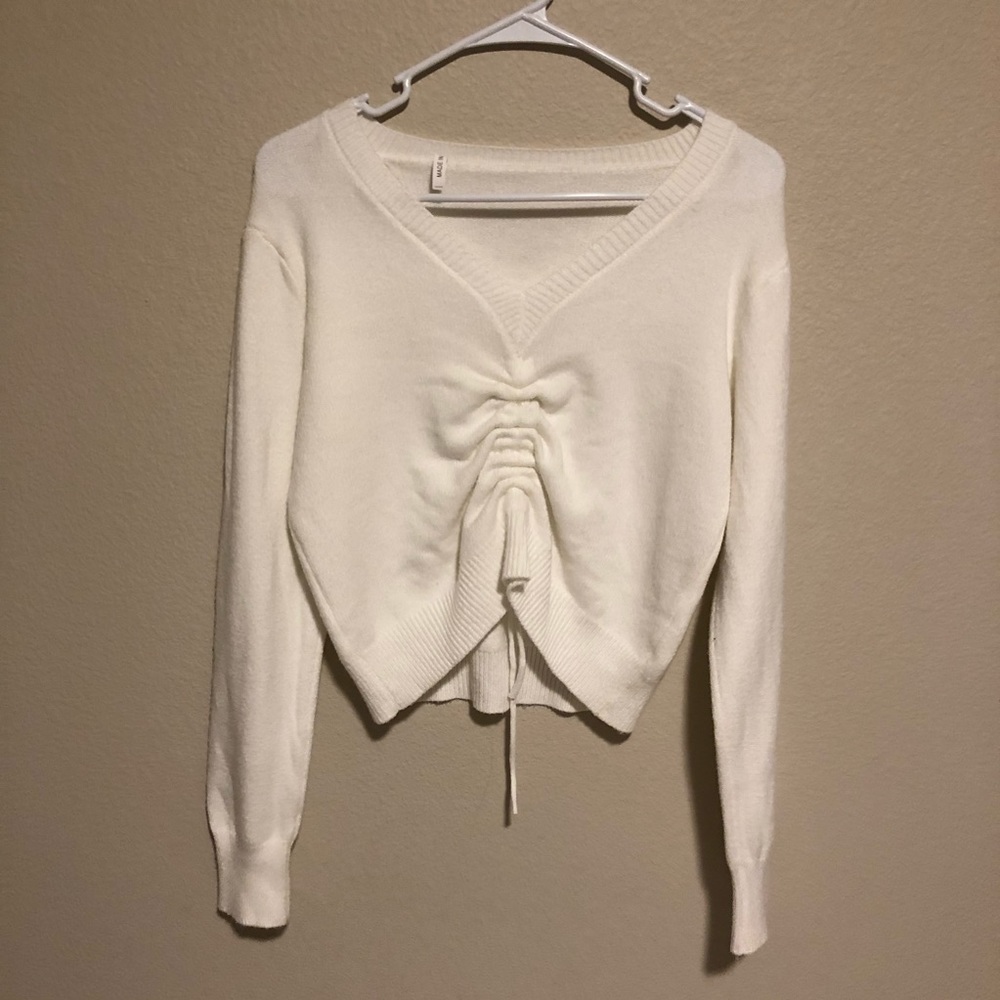 White cinched sweater